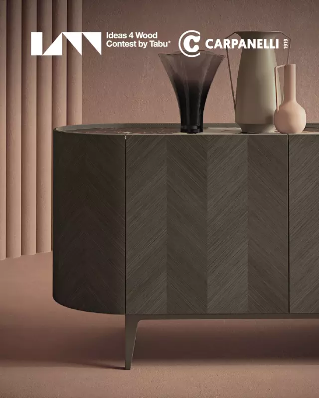Emerging from the 2020 edition of the #Ideas4wood Carpanelli Award in the Professionals category, the Alfea sideboard stands as one of the most eloquent expressions of the dialogue between architectural inspiration and the enduring values of Italian design culture.Inspired by one of the most iconic landmarks of Italian architecture, the Leaning Tower of Pisa, Alfea reinterprets vertical tension through a fluid and horizontal silhouette. Its rounded ends, defined by circular cross-sections, blend harmoniously with elongated volumes, achieving a refined balance between classical heritage and contemporary sensibility. The purity of its form is enhanced by an exquisite geometric inlay, while the top, available in lacquered glass, marble, wood or leather, allows for elegant customization. Hand-stitched leather upholstery and a metal base in bronze-gold or lead finish add a sense of artisanal sophistication and distinctive character. Combining visual elegance with generous internal space, Alfea features thoughtfully designed shelving that ensures functional organization without compromising its refined spirit.This creation is the result of the visionary talent of designer Mattia Fornari, developed in close collaboration with Carpanelli’s research and development department. A project that bridges architectural language and craftsmanship, telling a story of tradition reinterpreted through a contemporary lens.—Ispirata alla celebre Torre di Pisa, la credenza Alfea trasforma linee verticali in un profilo orizzontale sinuoso. Le estremità arrotondate si uniscono a volumi allungati, bilanciando classicità e innovazione. La purezza delle forme è valorizzata da un intarsio geometrico e da un top personalizzabile in vetro, marmo, legno o cuoio. Il rivestimento in cuoio cucito a mano e la base in metallo con finiture bronzo-oro o piombo aggiungono eleganza e carattere. Alfea combina estetica raffinata e ampi spazi interni, con ripiani funzionali.
A dare vita a questa creazione è il talento del designer Mattia Fornari, in collaborazione con il reparto R&S Carpanelli.#carpanelli #carpanellifurniture